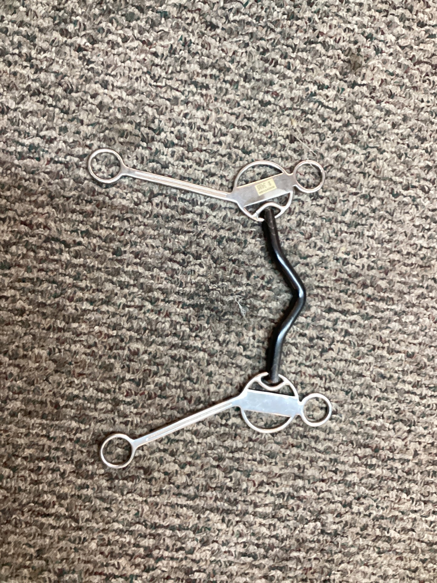 Sliding three ring curb bit low port