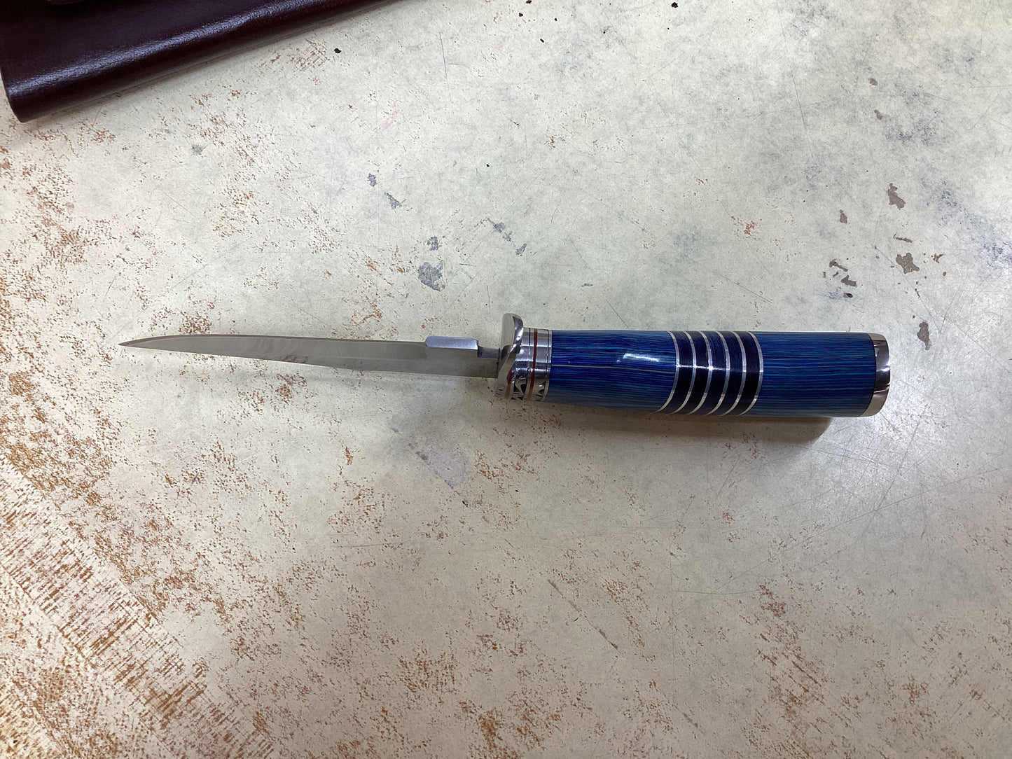 8 1/8” Stainless Blade with Blue Wood Handle and Leather Sheath
