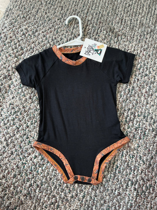 Caboose Kids Black Patchwork Onesie